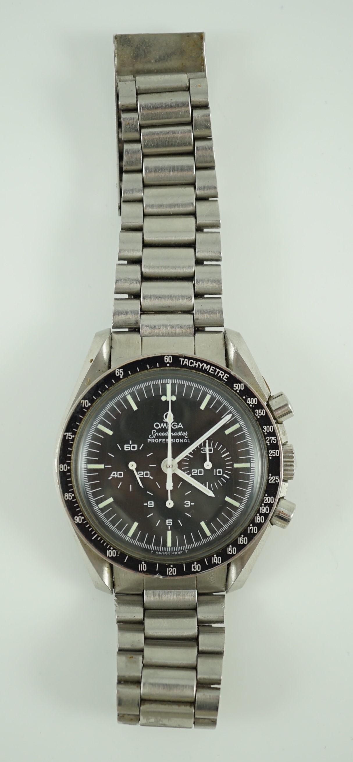 A gentleman's early 1980's stainless steel Omega Speedmaster Professional 'The First Watch Worn On The Moon' manual wind wrist watch, on stainless steel Omega bracelet